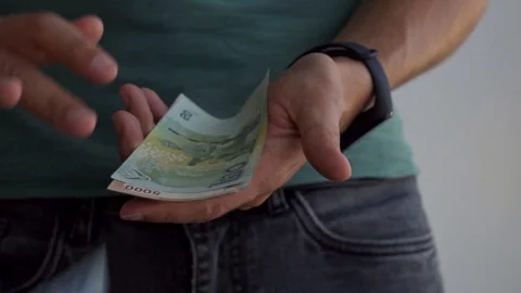 A man throws money from different countries, slow motion. Stock Footage 115850190