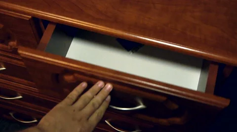 Man throws a new condom in the drawer with the clothes, close-up Видео 66002930