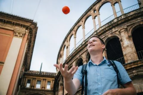 The man in throws up the orange Stock Photos