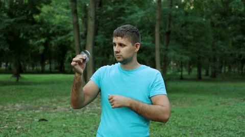 A man throws out a popular toy spinner. Stock Footage