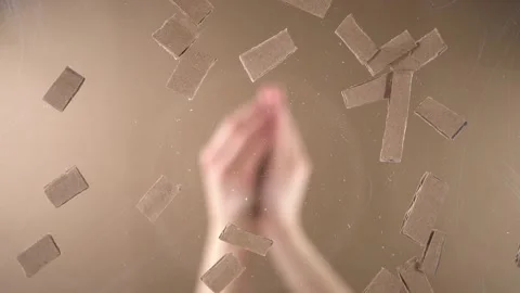 Man throws pieces of cardboard on a transparent surface. Stock Footage 143236083