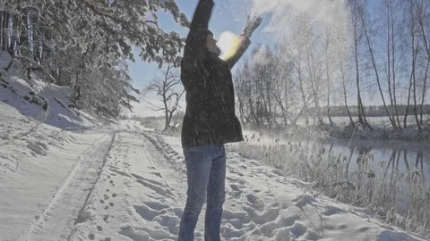 Man throws snow Stock Footage 71421290