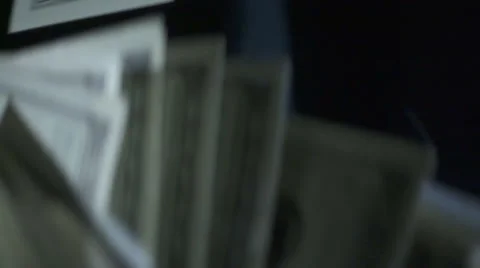 Man throws a stack of hundred dollar bills in slow motion Stock Footage 61534009