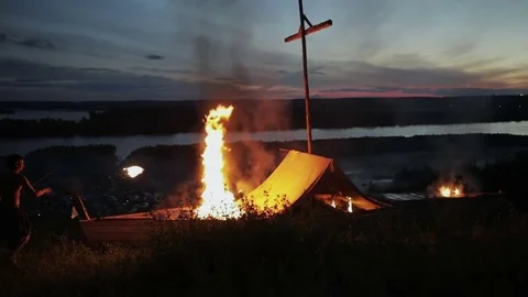 Man throws a torch into the fire Stock Footage 82347840