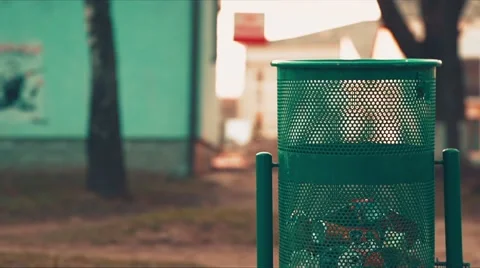 Man Throws Trash in Dustbin Stock Footage 48399489