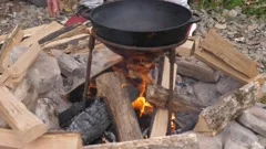 https://images.pond5.com/man-throws-wood-fire-under-footage-220781230_iconm.jpeg