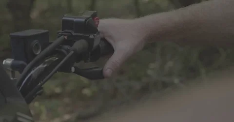 Man with thumb on ATV accelerator lever Stock Footage 76704107