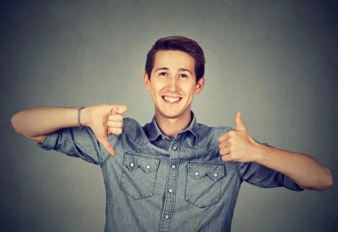 Man with thumbs down thumbs up gesture Stock Photos