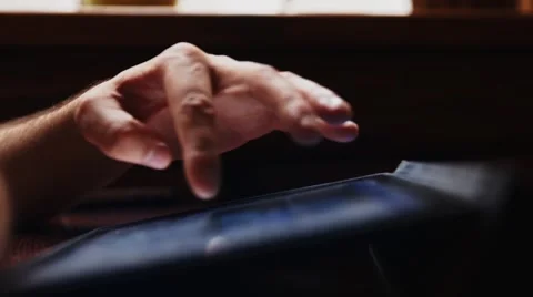 Man Thumbs Through Tablet Stock Footage 52004543