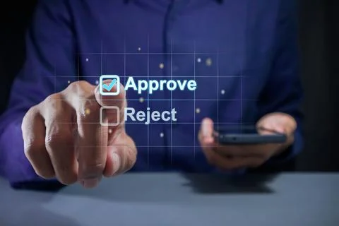 Man ticking a checkmark on a box on virtual screen to approve document or p.. Stock Photos