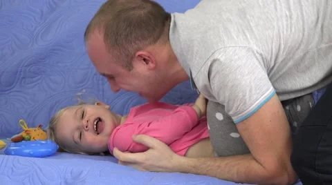 Man tickle and small child girl laugh Stock Footage 64037225
