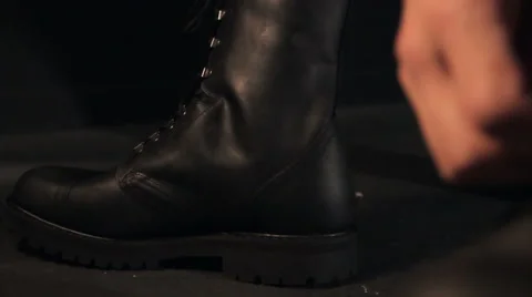 Man ties boots Stock Footage 62474717