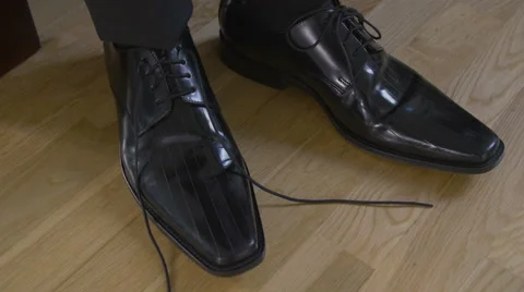 Man that ties shoelaces Stock Footage 61485711