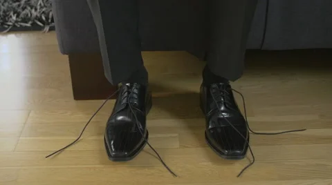 Man that ties shoelaces Stock Footage 61485968