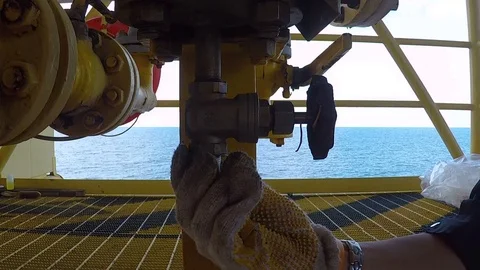 Man tighten plug into valve Stock Footage 87498030