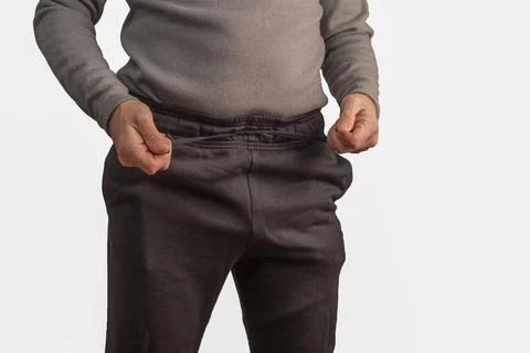 Man tightening drawstring on pants, Stock Photos