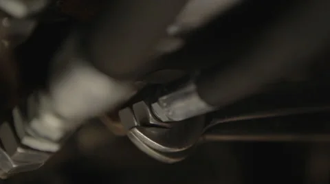 Man tightens a hydraulic hose using wrench Stock Footage 41664817