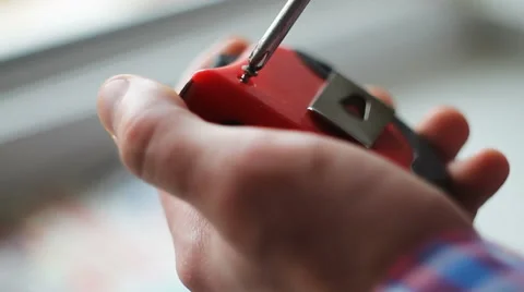 Man tightens a screw with a screwdriver Stock Footage 68918514