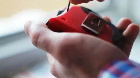 Man tightens a screw with a screwdriver Video stock 68919249