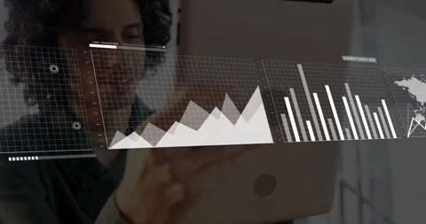 Man tilting tablet, showing floating line graph bar chart and world map overlays Stock Footage 327848192