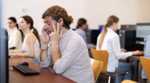 Man with tired eyes from working at computer Stock Photos