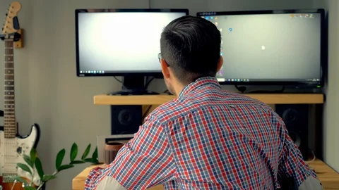 The man is tired of working at the computer and screams. Stock Footage 129982704