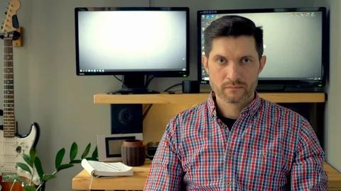 The man is tired of working at the computer and screams. Stock Footage 129985265