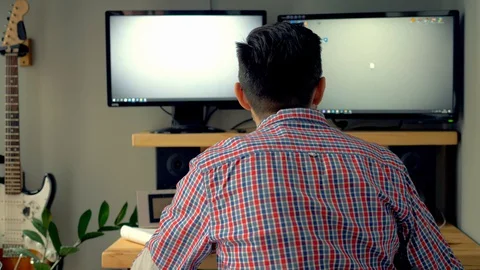 The man is tired of working at the computer and screams. Stock Footage 129985900