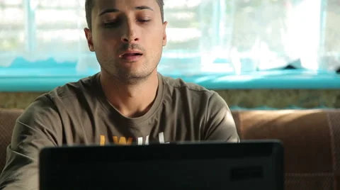 The man is tired from working at the computer, doing massage eyes. Freel Stock Footage 56370288