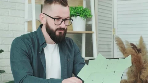 Man is tired from working on the computer, takes off glasses to rest his eyes. Stock Footage 155760157