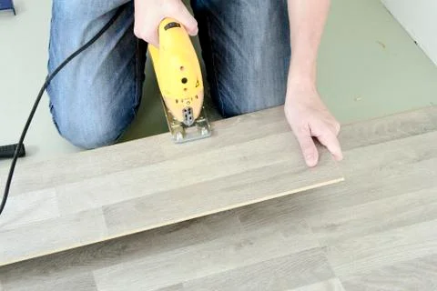 Man with Tools to Laying Laminate Stock Photos