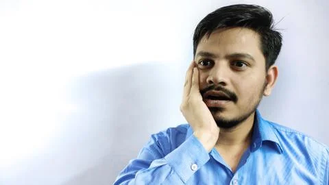 Man in tooth plain put hand on Face Stock Photos