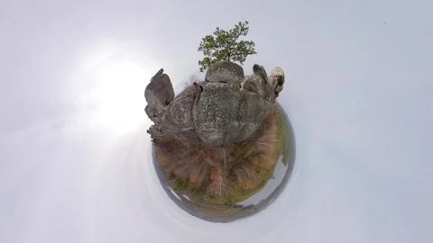 Man on top of a cliff. View of a small planet. 스톡 동영상 332351598