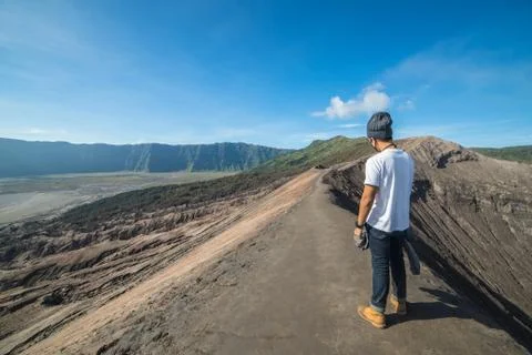Man on top of Layer Volcanic ash as sand ground of Mount Bromo volcano (Gunun Stock Photos