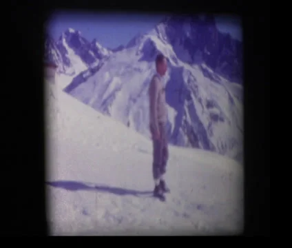 Man at top of Mammoth mountain pointing Stock Footage 33846138