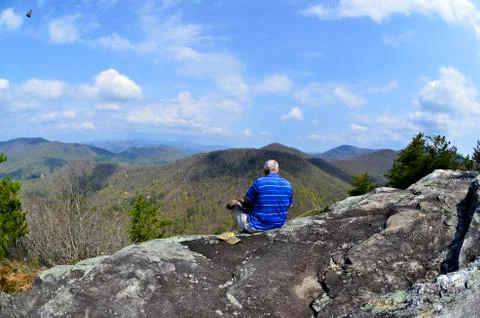 Man on top of a mountain Stock Photos