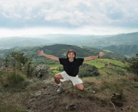 Man at the top of a mountain Stock Photos