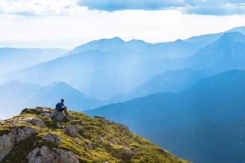 Man on the top of a rock Stock Photos