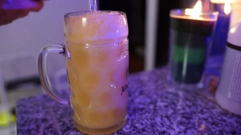 Man Tops Off Alcoholic Mixed Drink At Home Stock Footage 146155682