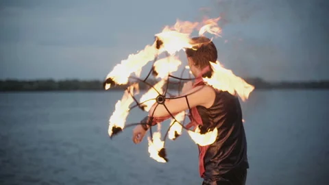 Man with torch fire show. slow motion 動画素材 113704011