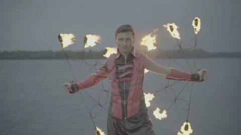Man with torch fire show. slow motion S-Log3 Video stock 114313505