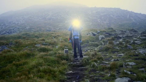 Man with torch light in the mountains 動画素材 103060488