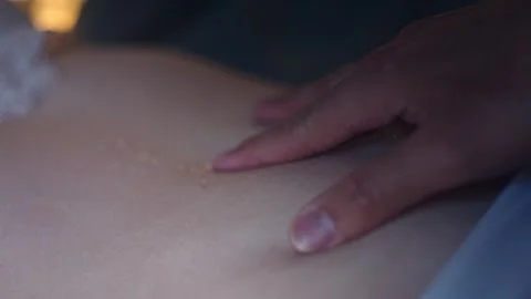 Man Touch And Slides Finger On Woman's Belly Lying In Bed. - close up shot Stock Footage 260312472