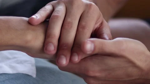 A man  touch hand young depressed man for encouragement on sofa. Stock Footage 163085125