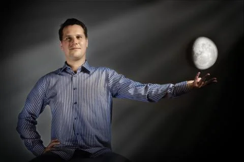 Man touch the moon Stock Photos