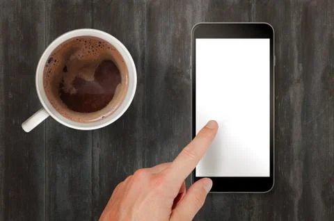 Man touch smart phone with isolated white screen for mockup. Top view scene w Stock Photos