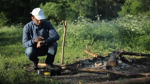 Man touch smartpwatch in camping Stock Footage 64058190