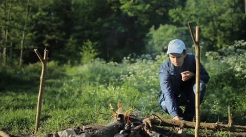 Man touch smartpwatch in camping Stock Footage 64058209