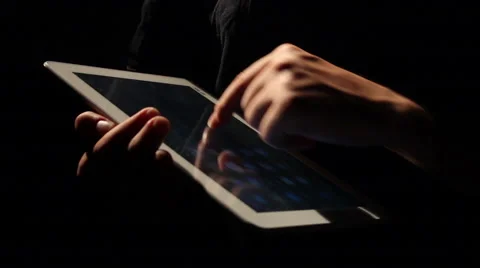Man touch tablet in dark Stock Footage 55077496
