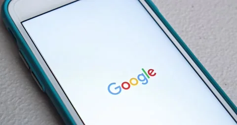 Man touches Google app and an app launches with animation, on iPhone Stock Footage 158933959